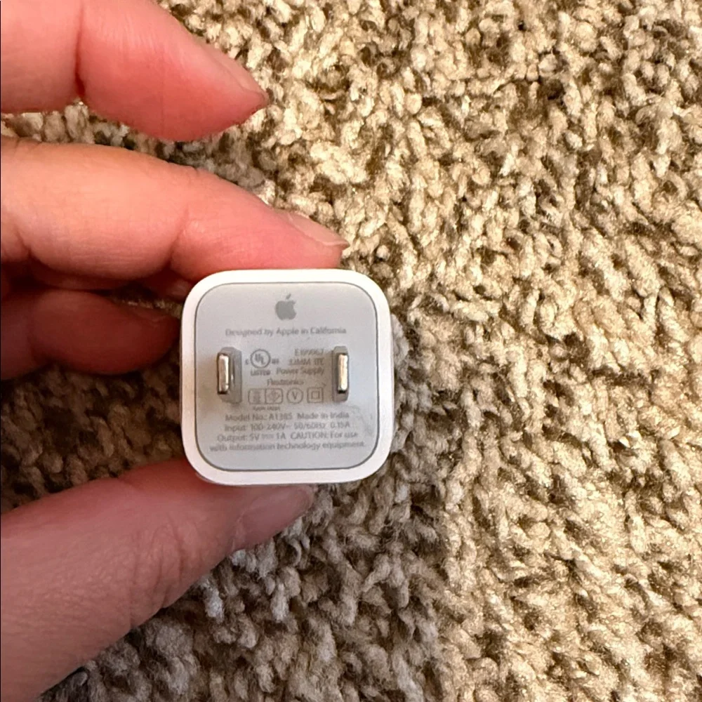 3 USB-A to Lightening Charging cables and one Apple charger block